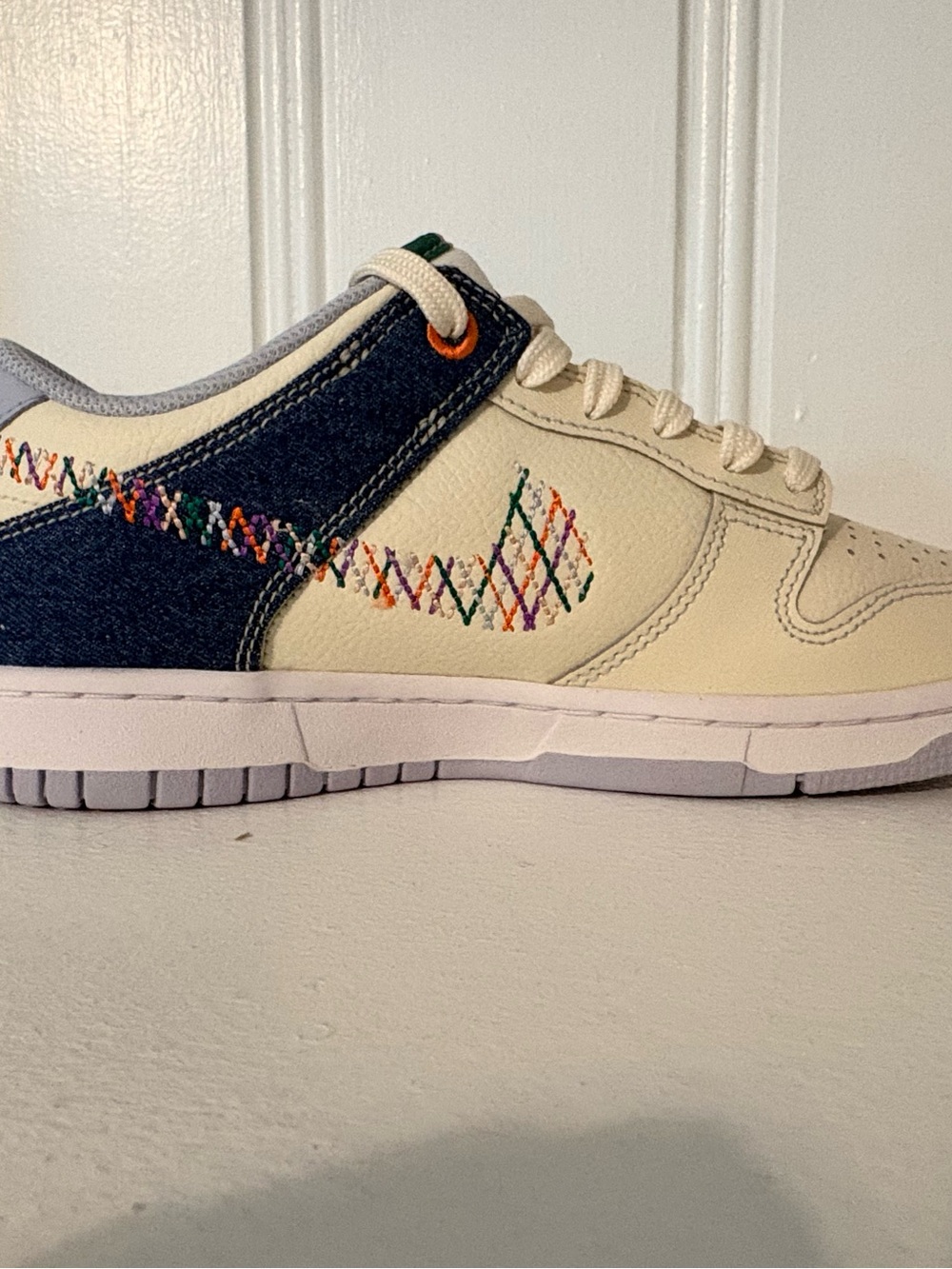 Nike Cream Low-Top Sneakers with Navy and Teal Accents - Picture 2 of 6